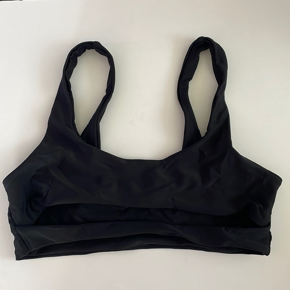 Women’s solid black bikini top from Shein in a size small, and never worn